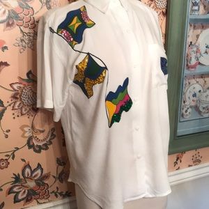 Shirt with sequin flags. Perfect for yachting, and sailing, cruising.